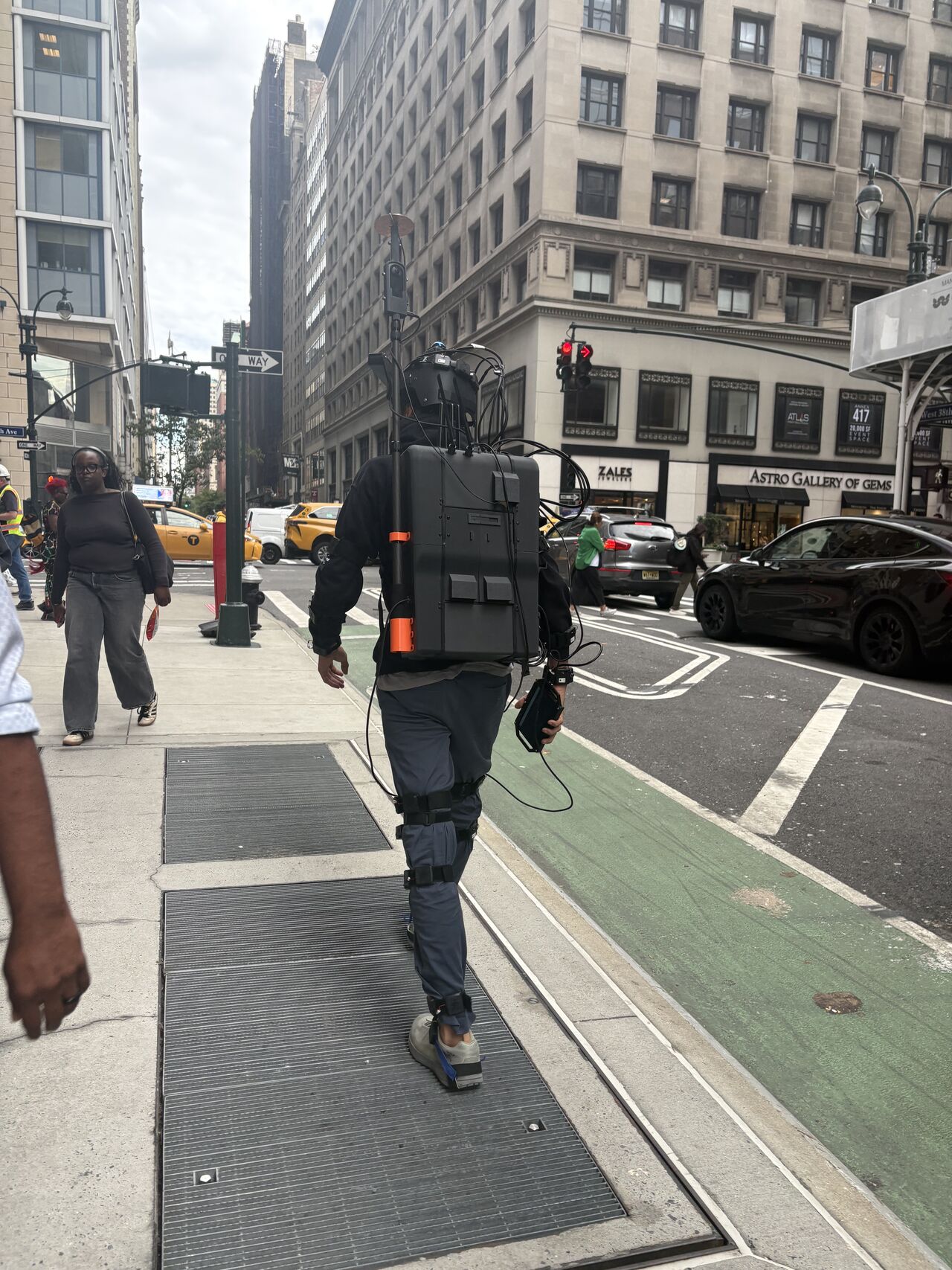 Operator wearing the THX rig walking along a Manhattan street corner